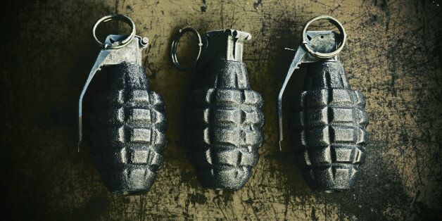 3 hand grenade (pineapple style) on scratchy rusty background