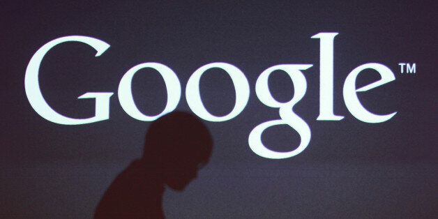 The shadow of a journalist is cast on a screen with the Google Inc. logo at a news conference in Seoul, South Korea, on Thursday, Sept. 27, 2012. Google Inc. will start selling its Nexus 7 tablet in South Korea on Oct. 7 to meet demand for mobile devices on the home turf of Samsung Electronics Co., the worldâs biggest seller of smartphones. Photographer: SeongJoon Cho/Bloomberg via Getty Images