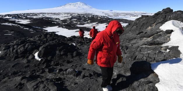 US Secretary of State John Kerry hikes in front of Mount Erebus after visiting the historic Shackleton hut near McMurdo Station during his visit to Antarctica on November 11, 2016.Kerry is travelling to Antarctica, New Zealand, Oman, the United Arab Emirates, Morocco and will attend the APEC summit in Peru later in the month. / AFP / POOL / MARK RALSTON (Photo credit should read MARK RALSTON/AFP/Getty Images)