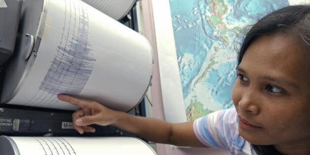 Jane Punongbayan, supervising science research specialist officer of phivolcs points to the seismograph readings of the 6.0-magnitude earthquake which shook the Philippine capital, 27 November 2007. The quake struck at 12:27 pm (0427 GMT) and was centred 195 kilometres (120 miles) northwest of Manila at a depth of depth 62.5 kilometres, the US Geological Survey said. There were no reports of damage or casualties from the quake, which was felt over large areas of the main Philippine island of Luzon, Philippine Institute of Volcanology and Seismology (Phivolcs) said. AFP PHOTO/JES AZNAR (Photo credit should read JES AZNAR/AFP/Getty Images)