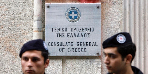 Turkish riot policemen stand guard during a demonstration in front of the Greek consulate in Istanbul December 13, 2008, as demonstrators protest following last week's fatal police shooting in Athens of 15-year-old Alexandros Grigoropoulos. REUTERS/Osman Orsal (TURKEY)