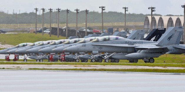 FILE PHOTO: Aircraft from Marine All Weather Fighter Attack Squadron 533 stand on the runway at Andersen Air Force Base, Guam September 15, 2014. U.S. Air Force/Staff Sgt. Robert Hicks/Handout/File Photo via REUTERS. ATTENTION EDITORS - THIS IMAGES WAS PROVIDED BY A THIRD PARTY