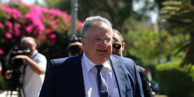 Greek Foreign Minister Nikos Kotzias arrives at the Presidential Palace in Nicosia, Cyprus July 18, 2017. REUTERS/Yiannis Kourtoglou