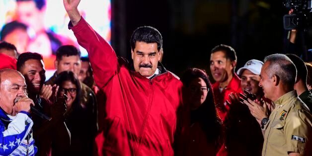 TOPSHOT - Venezuelan president Nicolas Maduro celebrates the results of 'Constituent Assembly', in Caracas, on July 31, 2017.Deadly violence erupted around the controversial vote, with a candidate to the all-powerful body being elected shot dead and troops firing weapons to clear protesters in Caracas and elsewhere. / AFP PHOTO / RONALDO SCHEMIDT (Photo credit should read RONALDO SCHEMIDT/AFP/Getty Images)