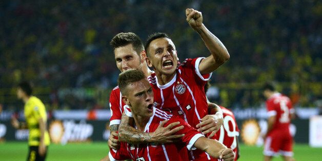 Soccer Football - Borussia Dortmund vs FC Bayern Munich - DFL-Supercup Final - Dortmund, Germany - August 5, 2017 Bayern Munichâs Joshua Kimmich celebrates after scoring their second goal REUTERS/Wolfgang Rattay DFL RULES TO LIMIT THE ONLINE USAGE DURING MATCH TIME TO 15 PICTURES PER GAME. IMAGE SEQUENCES TO SIMULATE VIDEO IS NOT ALLOWED AT ANY TIME. FOR FURTHER QUERIES PLEASE CONTACT DFL DIRECTLY AT + 49 69 650050.