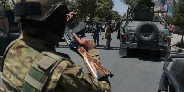 Afghan security arrive at the site of a suicide blast near Iraq's embassy in Kabul on July 31, 2017.A series of explosions and the sound of gunfire shook the Afghan capital on July 31, with a security source telling AFP that a suicide bomber had blown himself up in front of the Iraqi embassy. 'Civilians are being evacuated' from the area as the attack is ongoing, said the official, who declined to be named. / AFP PHOTO / SHAH MARAI (Photo credit should read SHAH MARAI/AFP/Getty Images)