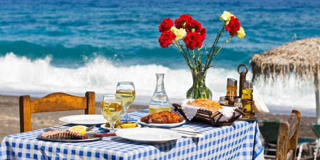 Beautiful romantic table on the beach near the sea