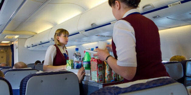 Moscow, Russia - May 14, 2013: Flight attendants serve passengers of UT-578 airlines UTair.