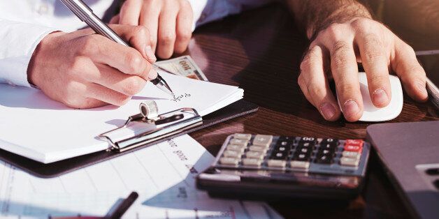 Office, business tools with dollars and calculator on table