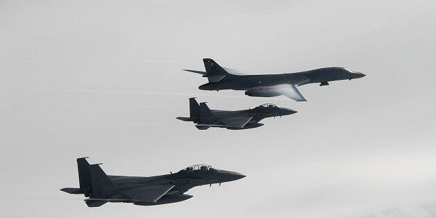 KOREAN PENINSULA, SOUTH KOREA - JULY 08: In this handout photo released by the South Korean Defense Ministry, A U.S. Air Force B-1B Lancer bomber (Top) fly with South Korean jets over the Korean Peninsula during a South Korea-U.S. joint live fire drill on July 8, 2017 in Korean Peninsula, South Korea. The U.S. said that it will use military force if needed to stop North Korea's nuclear missile program after North Korea fired an intercontinental ballistic missile on Tuesday into Japanese waters. The latest launch have drawn strong criticism from the U.S. as experts believe the ICBM has the range to reach the U.S. states of Alaska and Hawaii and perhaps the U.S. Pacific Northwest. (Photo by South Korean Defense Ministry via Getty Images)
