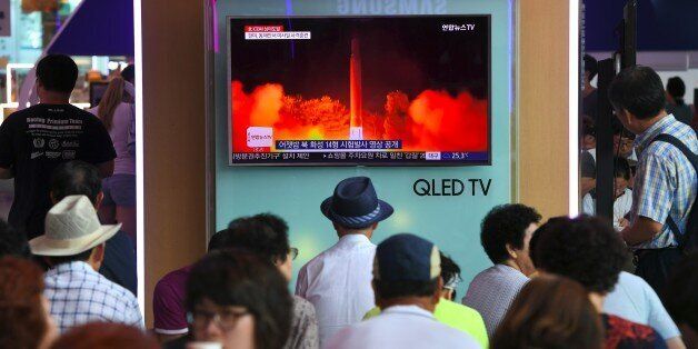 People watch a television screen showing a video footage of North Korea's latest test launch of an intercontinental ballistic missile (ICBM), at a railway station in Seoul on July 29, 2017.North Korean leader Kim Jong-Un said on July 29 the country's second ICBM test demonstrated the ability to strike any target in the United States, in a direct challenge to President Donald Trump who had issued dire warnings over its missile program. / AFP PHOTO / JUNG Yeon-Je (Photo credit should read JUNG YEON-JE/AFP/Getty Images)