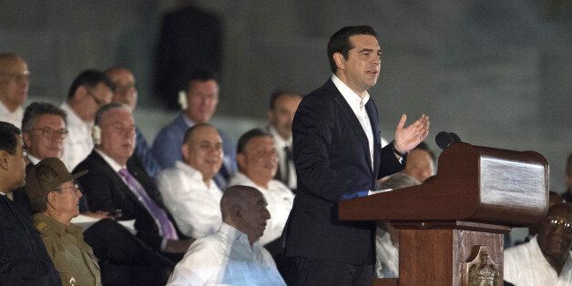 Greece's Prime Minister Alexis Tsipras delivers a speech during a massive rally at Revolution Square in Havana in honor of late leader Fidel Castro. Next to him, Cuban President Raul Castro (2nd-L) and Venezuela's Nicolas Maduro (L).Castro -- who ruled from 1959 until an illness forced him to hand power to his brother Raul in 2006 -- died Friday at age 90. The cause of death has not been announced. / AFP / JUAN BARRETO (Photo credit should read JUAN BARRETO/AFP/Getty Images)