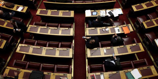 Greek lawmakers attend a parliamentary session before a vote on a one-off benefit approved to pensioners in Athens, Greece, December 15, 2016. REUTERS/Alkis Konstantinidi