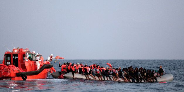 Migrant are seen during rescue operation in the Mediterranea Sea October 20, 2016. Yara Nardi/Italian Red Cross press office/Handout via Reuters REUTERS ATTENTION EDITORS - THIS IMAGE WAS PROVIDED BY A THIRD PARTY. EDITORIAL USE ONLY.