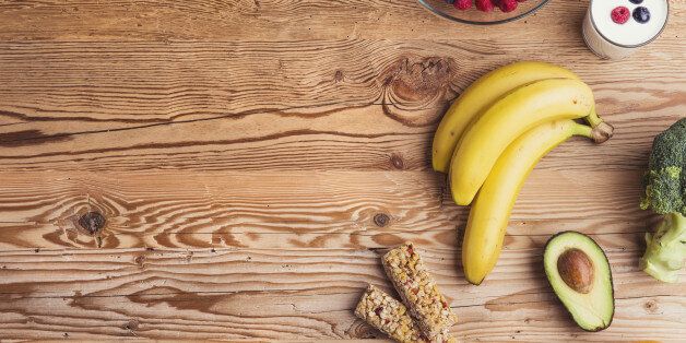 Healthy food composition on a wooden table background