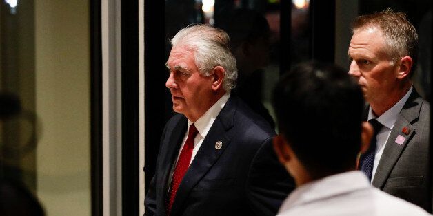 US Secretary of State Rex Tillerson (L) arrives at the Conrad hotel in Manila on August 6, 2017.The annual...
