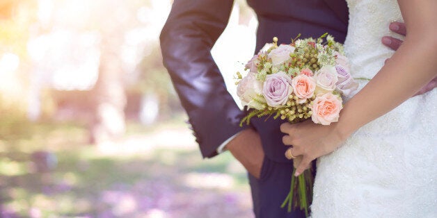 Bride holding bouquet.