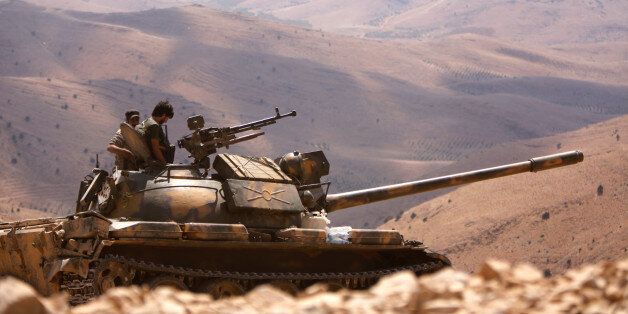 A Syrian tank loyal to Syria's President Bashar al-Assad forces is seen in Fleita, Syria August 2, 2017. REUTERS/ Omar Sanadiki