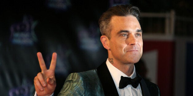 Singer Robbie Williams arrives to attend the NRJ Music Awards ceremony at the Festival Palace in Cannes, France, November 12, 2016. REUTERS/Eric Gaillard