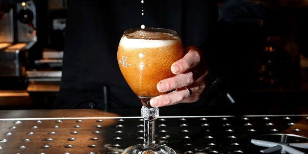 A bartender pours a beer in a pub on Brussels Grand Place, Belgium, November 25, 2016. REUTERS/Francois Lenoir