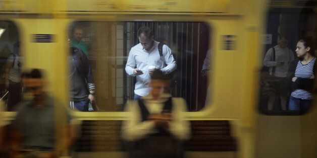 A man looks at his phone in the underground tube in London, Britain June 16, 2017. REUTERS/Kevin Coombs