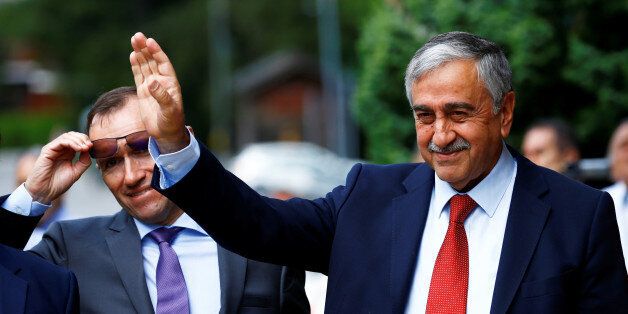 Turkish Cypriot leaderÂ Mustafa Akinci and United Nations Special Advisor on Cyprus Espen Barth Eide arrive for peace talks on divided Cyprus under the supervision of the United Nations in the alpine resort of Crans-Montana, Switzerland June 28, 2017. REUTERS/Denis Balibouse