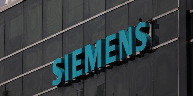 A logo of Siemens is pictured on a building in Mexico City, Mexico, May 16, 2017. REUTERS/Edgard Garrido