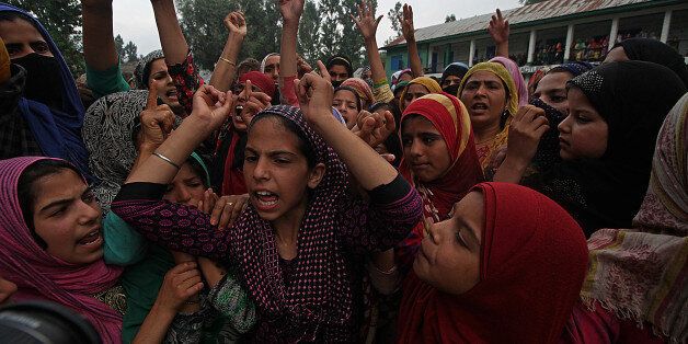 INDIA - 2017/07/18: Girls shout pro freedom slogans during the funeral of Showkat Ahmad Lohar a rebel of Lashkar-e-Toiba rebel outfit in south Kashmir's Bijbehara some 45 kilometers from Srinagar the summer capital of Indian controlled Kashmir on July 18, 2017. Showkat was killed with two other rebels when government forces ambushed the rebels in south Kashmir's Anantnag.funeral, death, mourning, conflict, war. (Photo by Faisal Khan/Pacific Press/LightRocket via Getty Images)