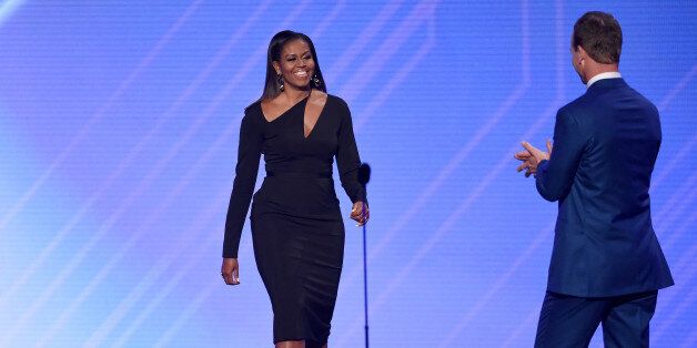 LOS ANGELES, CA - JULY 12: Former First Lady Michelle Obama greets host Peyton Manning onstage at The 2017 ESPYS at Microsoft Theater on July 12, 2017 in Los Angeles, California. (Photo by Kevin Winter/Getty Images)