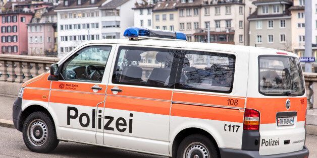 Zurich, Switzerland - 4 December, 2015: a parked van of Zurich Municipal Police, old town buildings in the background. Zurich Municipal Police is the third largest police corps in Switzerland, after Zurich Cantonal Police and Bern Cantonal Police. Zurich is the largest city of the country.