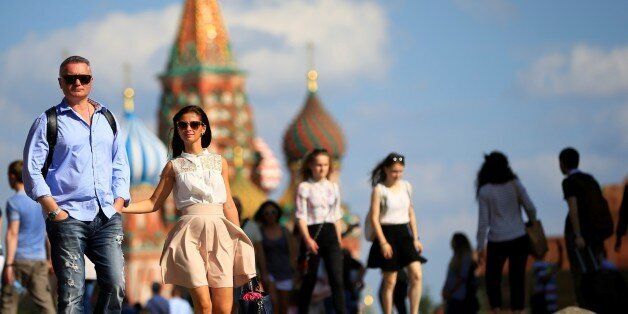 MOSCOW, RUSSIA - JULY 12: Russian people walk at the Red Square, in Moscow, Russia, on July 12, 2016. (Photo by Sefa Karacan/Anadolu Agency/Getty Images)