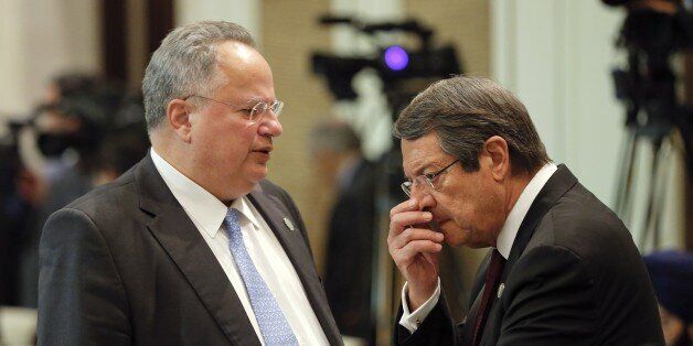 Greek Foreign Minister Nikos Kotzias (L) talks to Cyprus' President Nicos Anastasiades before the opening session of the 11th Asia-Europe Meeting (ASEM) Summit in the Mongolian capital of Ulan Bator on July 15, 2016.The 11th Asia-Europe Meeting (ASEM) summit runs from July 15 to 16. / AFP / POOL / DAMIR SAGOLJ (Photo credit should read DAMIR SAGOLJ/AFP/Getty Images)