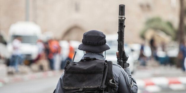 Israeli riot policeman is securing a scene of an attack where earlier a 16 year old Palestinian stabbed two Jewish men and later was shot by Israeli security personnel near Damascus Gate outside the old city quarter in Jerusalem, on October 10, 2015.***ISRAEL OUT*** (Photo by Omer Messinger/NurPhoto) (Photo by NurPhoto/NurPhoto via Getty Images)