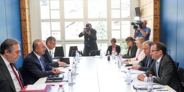 CRANS-MONTANA, SWITZERLAND - JULY 06: Foreign Affairs Minister of Turkey Mevlut Cavusoglu (2nd L) meets with UN Secretary-General Antonio Guterres (2nd R) during a conference on Cyprus in Crans-Montana, Switzerland on July 06, 2017. (Photo by Cem Ozdel/Anadolu Agency/Getty Images)