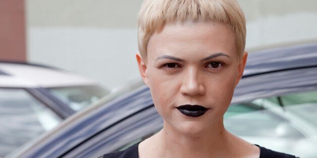 woman with black lipstick , car background