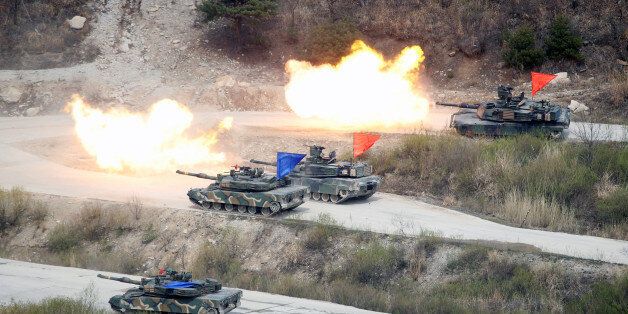 South Korean Army K1A1 and U.S. Army M1A2 tanks fire live rounds during a U.S.-South Korea joint live-fire military exercise, at a training field, near the demilitarized zone, separating the two Koreas in Pocheon, South Korea April 21, 2017. Picture taken on April 21, 2017. REUTERS/Kim Hong-Ji TPX IMAGES OF THE DAY