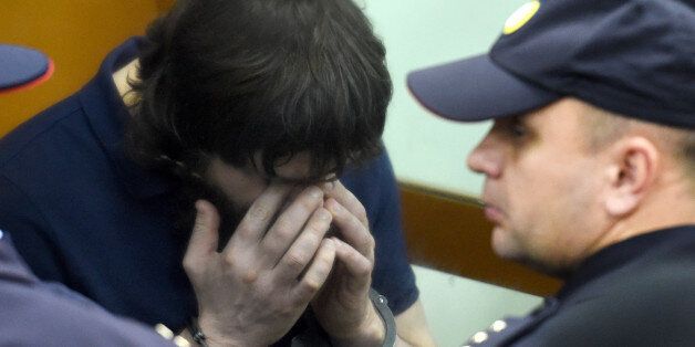 Zaur Dadayev, one of five men convicted of organising and carrying out the contract killing of opposition leader Boris Nemtsov, reacts during the sentencing at the Moscow District Military Court on July 13, 2017. / AFP PHOTO / Vasily MAXIMOV (Photo credit should read VASILY MAXIMOV/AFP/Getty Images)
