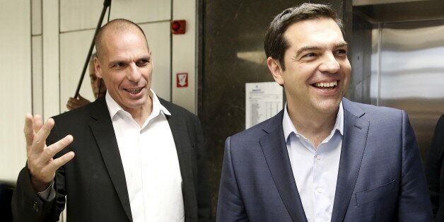 Greek Finance Minister Yanis Varoufakis (L) welcomes Prime Minister Alexis Tsipras for a meeting at the ministry in Athens, Greece May 27, 2015. Fiscal targets, pension and labour market reform and the size of the civil service are the key issues yet to be agreed between Greece and its international creditors in debt talks as Athens' cash dries up, the European Commission said on Wednesday. REUTERS/Alkis Konstantinidis TPX IMAGES OF THE DAY