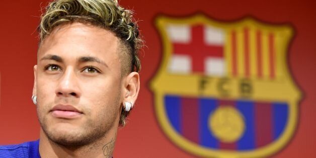 FC Barcelona football star Neymar answers questions during a press conference to announce new sponsorship with Japanese internet retailer Rakuten in Tokyo on July 13, 2017.Japan's major internet retailer Rakuten entered into main sponsorship contract with FC Barcelona. / AFP PHOTO / Toru YAMANAKA (Photo credit should read TORU YAMANAKA/AFP/Getty Images)