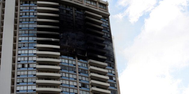 The Marco Polo apartment building after a fire broke out in it in Honolulu, Hawaii, July 14, 2017. REUTERS/Hugh Gentry