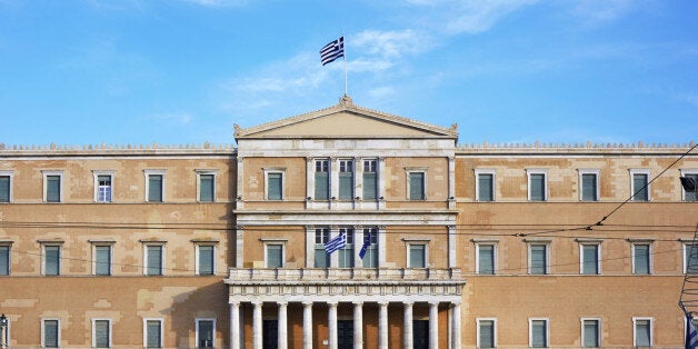 Tourists outside the old parliament building of Athens in Syntagma square