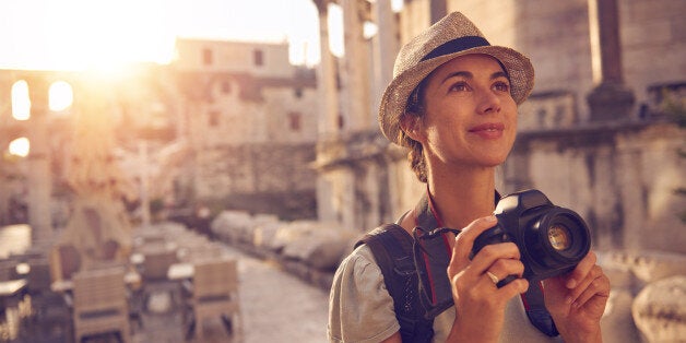 Shot of a woman taking photos while exploring a foreign cityhttp://195.154.178.81/DATA/i_collage/pu/shoots/805976.jpg