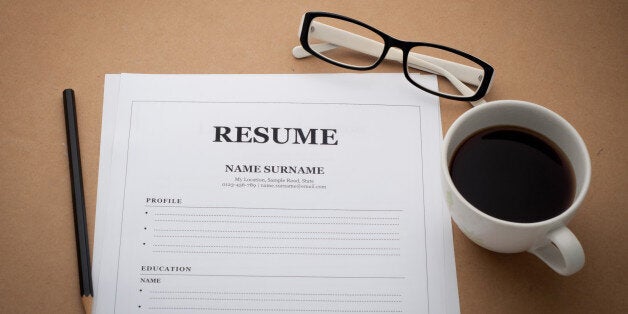 office desk with resume information, Coffee cup, black pencil and black white glasses.