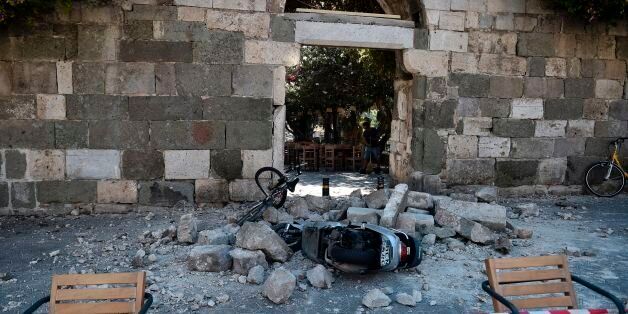 A man sweeps away rubble following on the Island of Kos following a 6.5 magnitude earthquake which struck the region early on July 21, 2017. Two foreigners died and more than 100 people were injured on the Greek island of Kos when an earthquake shook popular Greek and Turkish holiday destinations in the Aegean Sea. The epicentre of the 6.7 magnitude quake was some 10.3 kilometres (6.4 miles) south of the major Turkish resort of Bodrum, a magnet for holidaymakers in the summer, and 16.2 kilometres east of the island of Kos in Greece, the US Geological Survey said. / AFP PHOTO / LOUISA GOULIAMAKI (Photo credit should read LOUISA GOULIAMAKI/AFP/Getty Images)