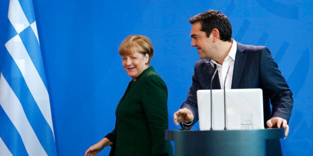 German Chancellor Angela Merkel and Greek Prime Minister Alexis Tsipras (R) leave after a statement at the chancellery in Berlin, Germany, December 16, 2016. REUTERS/Fabrizio Bensch