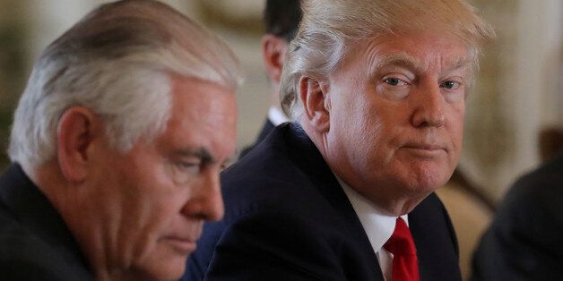 U.S. President Donald Trump (R) sits next to Secretary of State Rex Tillerson during a bilateral meeting with China's President Xi Jinping (Not Pictured) at Trump's Mar-a-Lago estate in Palm Beach, Florida, U.S., April 7, 2017.