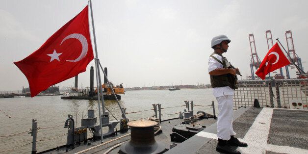 A Turkish Maritime Task Group personal stand guards on the TCG Barbaros ship anchored off Karachi Port during the frigate's visit to Pakistan July 2, 2011.The frigate is part of the Turkish Maritime Task Group, which is deployed on a yearly basis to promote security and stability at sea and protect ships from piracy threats. REUTERS/Athar Hussain (PAKISTAN - Tags: POLITICS)