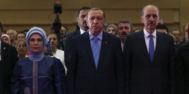 ANKARA, TURKEY - JULY 14: President of Turkey, Recep Tayyip Erdogan (C) and his wife Emine Erdogan (L) and Deputy Prime Minister of Turkey Numan Kurtulmus (R) attend a panel on July 15 coup attempt at ATO Congresium in Ankara, Turkey on July 14, 2017. (Photo by Murat Kula/Anadolu Agency/Getty Images)