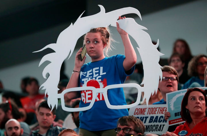 Carly Hein of Omaha, Nebraska, talks on her cell phone as she waits for Sen. Bernie Sanders, I-Vt., to arrive at a rally for