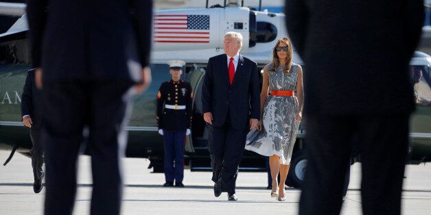 U.S. President Donald Trump and First Lady Melania Trump board Air Force One during their departure back to Washington, at Hamburg International Airport, in Hamburg, Germany, July 8, 2017. REUTERS/Carlos Barria